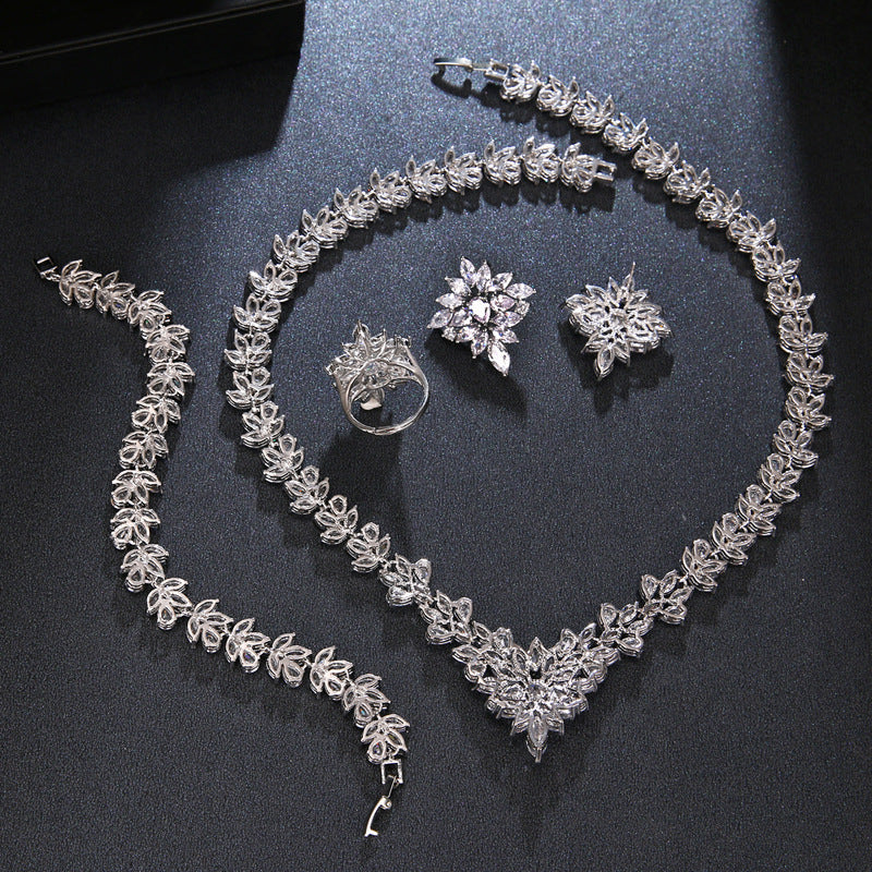 Silver zircon bridal necklace and bracelet set with coordinated floral ring