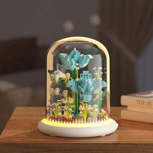 Decorative lamp with a glass dome on a wooden surface