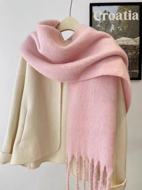 Women's wool-like scarf, pink, fringed ends, soft wrap folded into a neat cowl on display