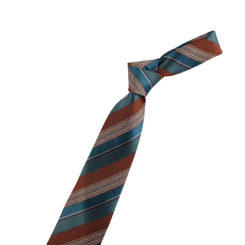 Striped tie with a decorative pin on a white background