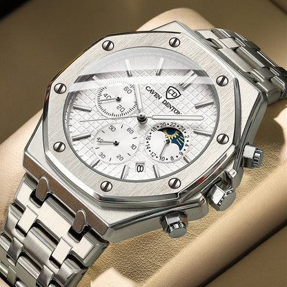 Silver watch with detailed face on a wrist against a beige background