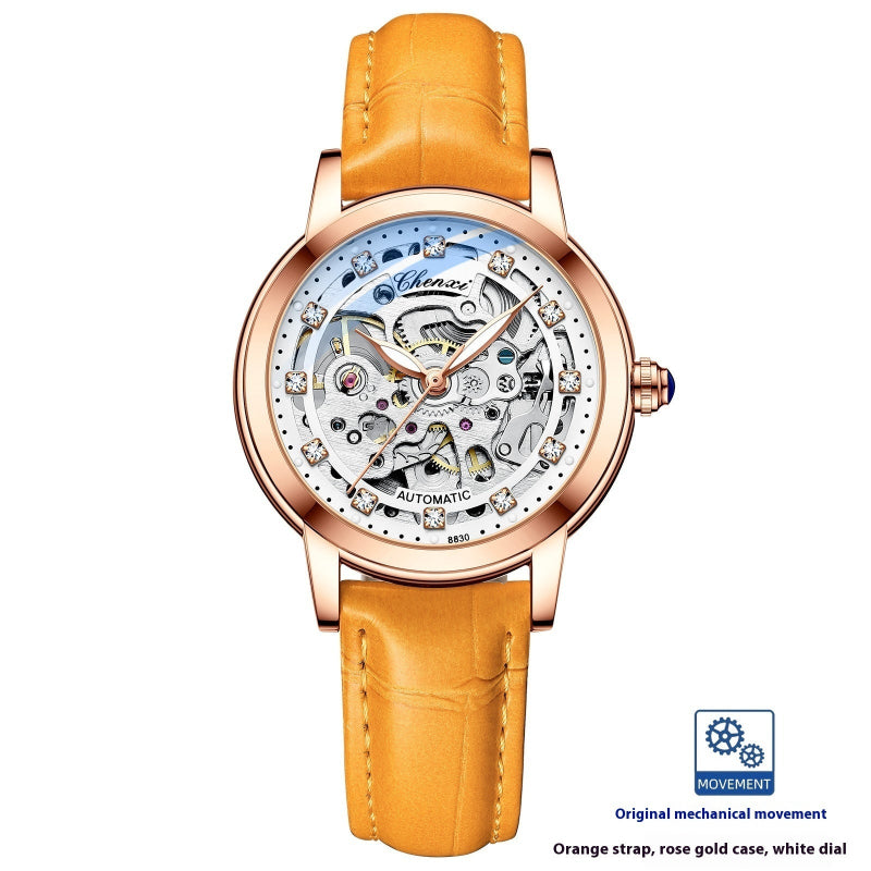 Rose gold skeleton mechanical watch with orange leather strap and open dial