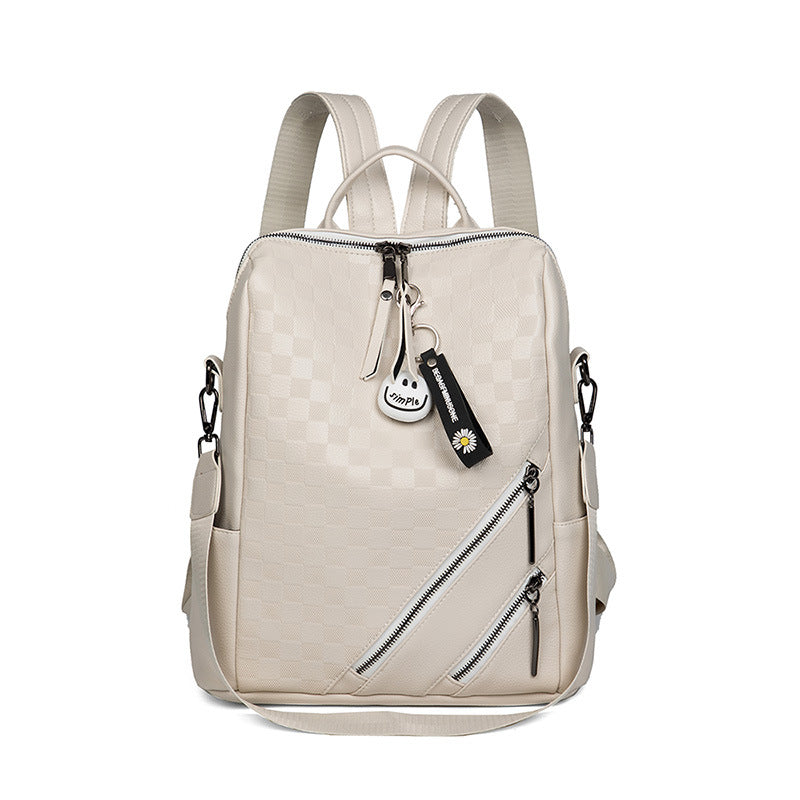 Beige backpack with a visible brand tag on a white background