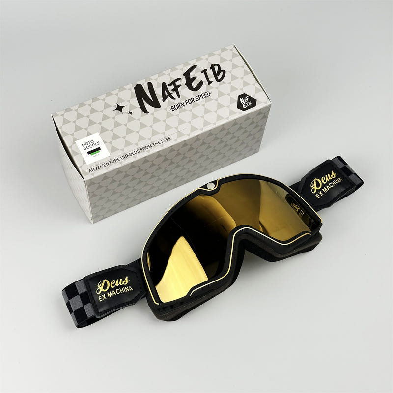 Black motorcycle goggles with amber reflective lens and adjustable strap