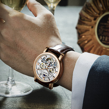 Close-up of a hand wearing a luxurious watch with a glass of wine in the background