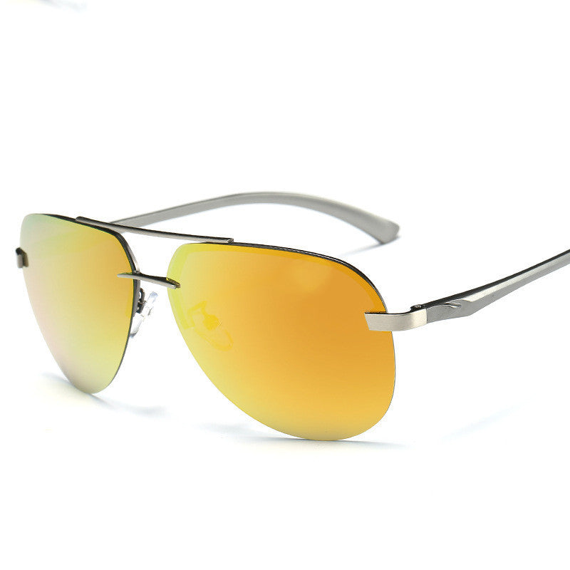 Sunglasses with yellow lenses and silver frames on a white background