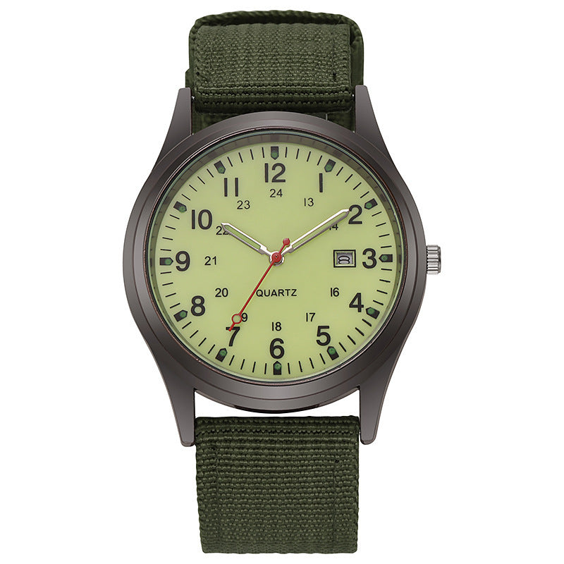 Quartz wristwatch with olive canvas strap and pale lime dial, date window at 3 o’clock.