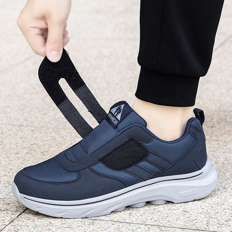 Dark blue lightweight casual sneakers with black strap panels and white cushioned sole
