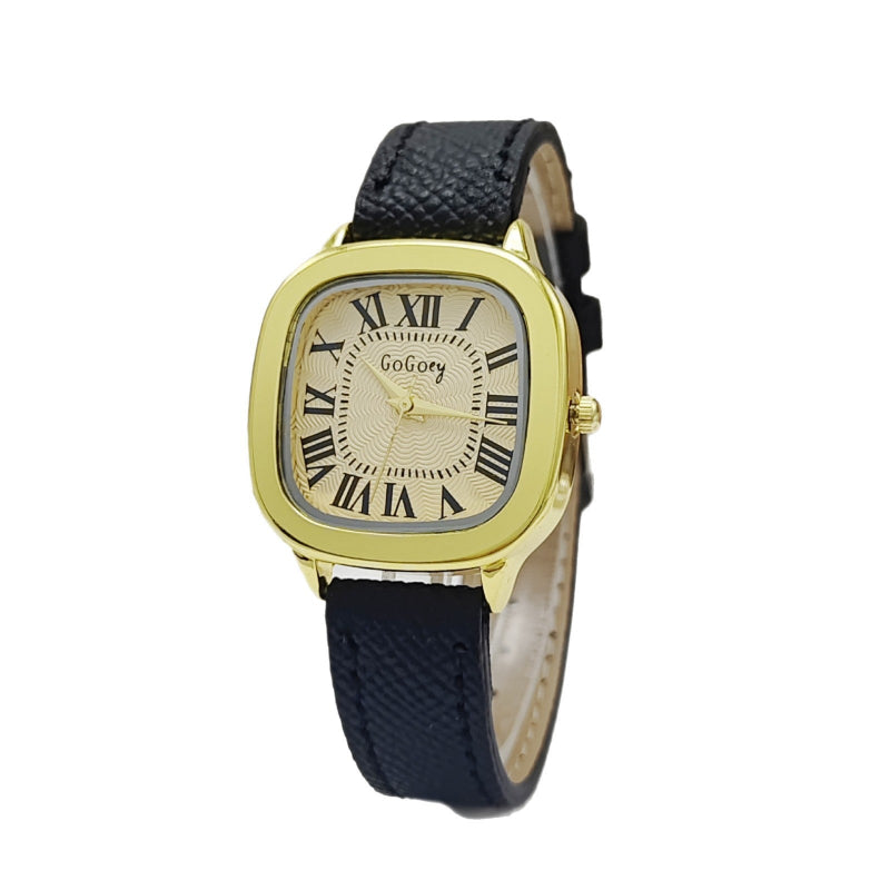 Women’s retro Roman dial leather strap watch with gold case and navy leather strap.