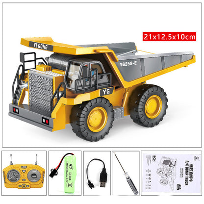 Yellow and gray RC excavator toy model with remote controller and included accessories
