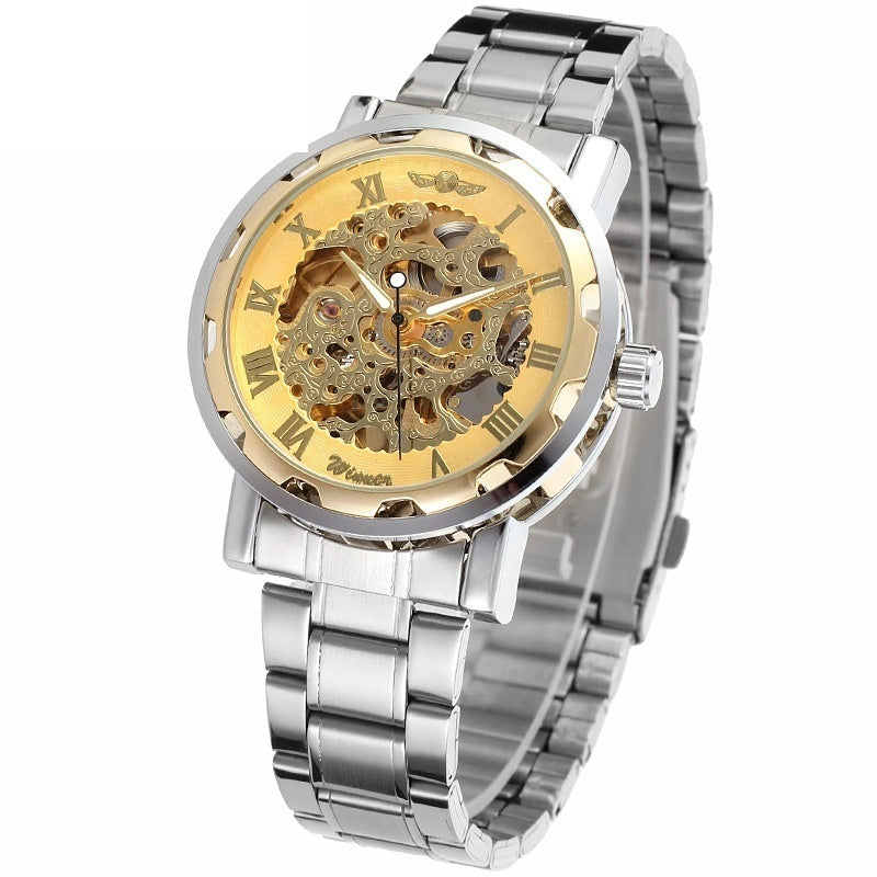 Mechanical skeleton watch with golden dial and exposed gears, silver metal bracelet