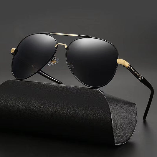 Black sunglasses with gold accents on a black background