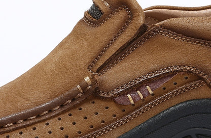 Close-up of a brown leather shoe with stitching details on a white background