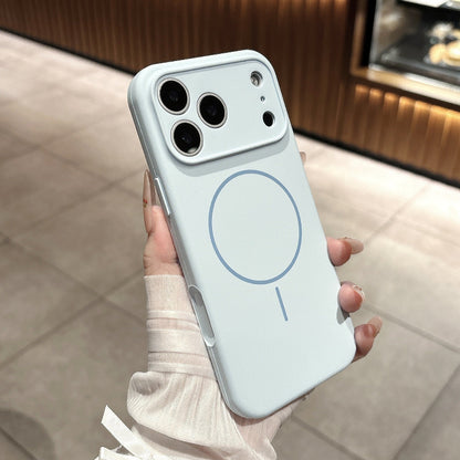 Phone case with a magnetic charging symbol held by a person wearing a white sweater.