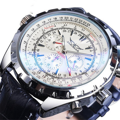 Close-up of a detailed wristwatch with a white face and black leather strap.