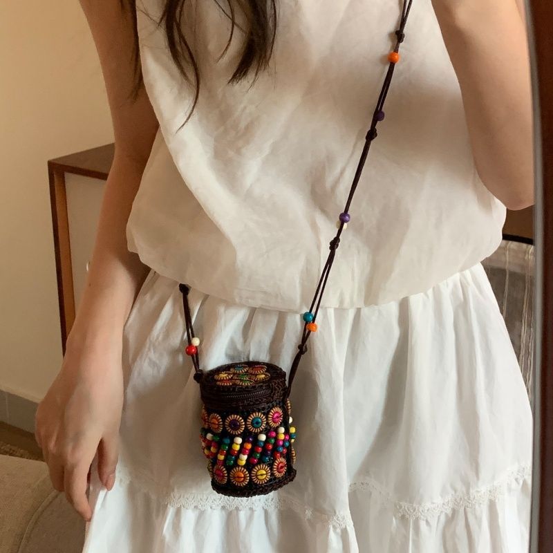 Handmade woven crossbody bag, black round with colorful bead embroidery and long strap