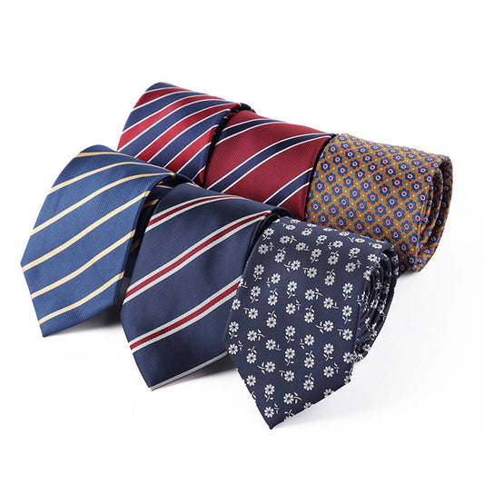 Collection of various patterned ties on a white background