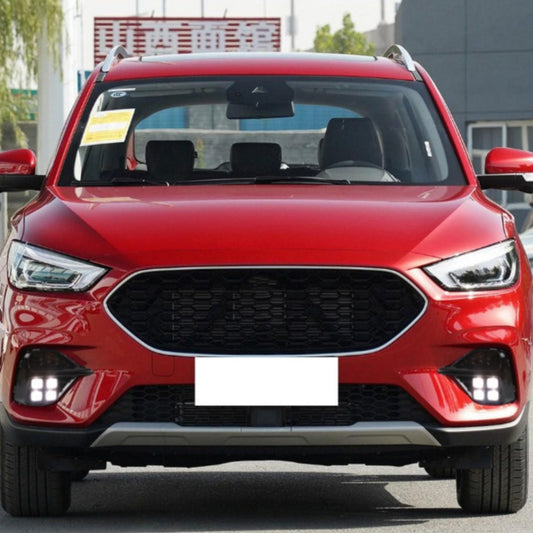 Red SUV with a clear sky background