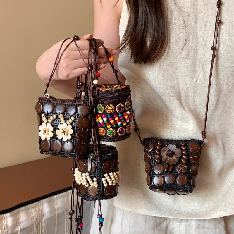 Handmade woven crossbody bag, dark brown round with white bead flowers and tassels
