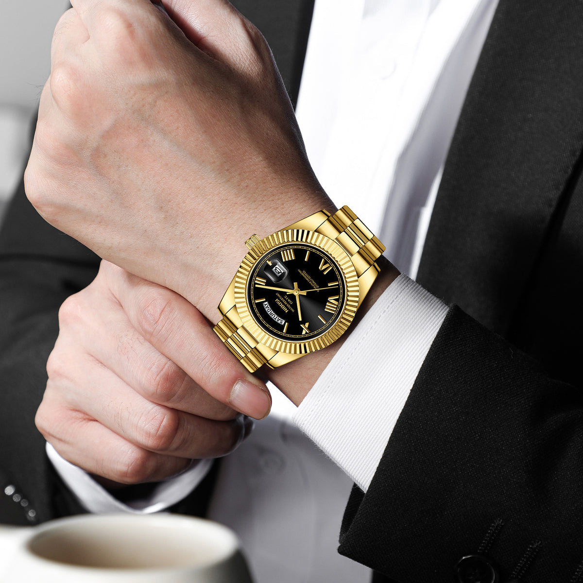 Men's quartz watch worn on wrist with gold steel bracelet and black dial