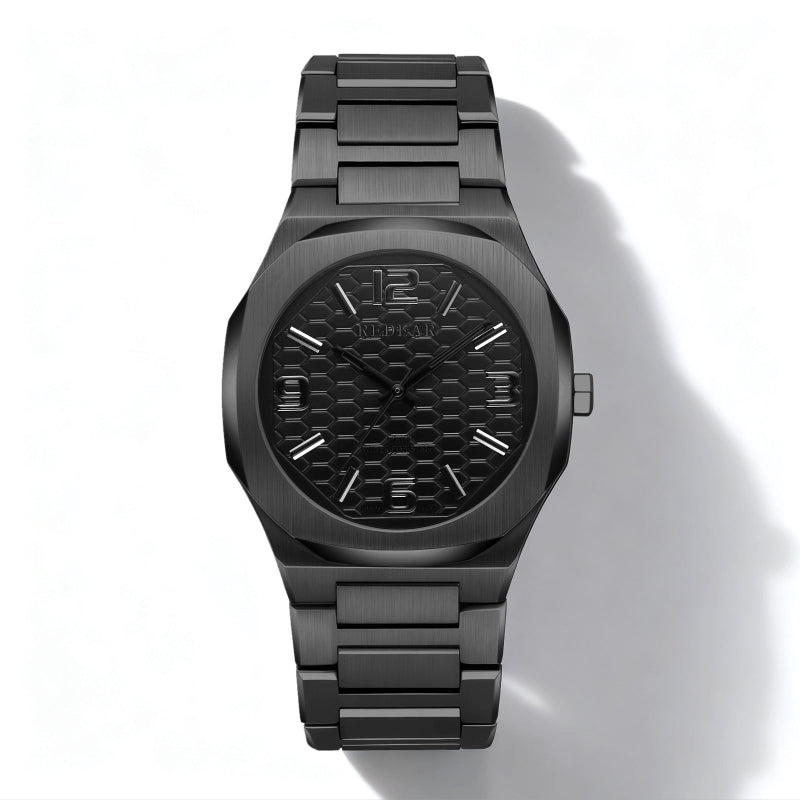 Black watch with a textured face on a white background