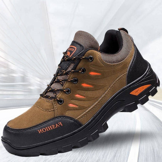 Brown and black hiking shoe with orange accents on a white background