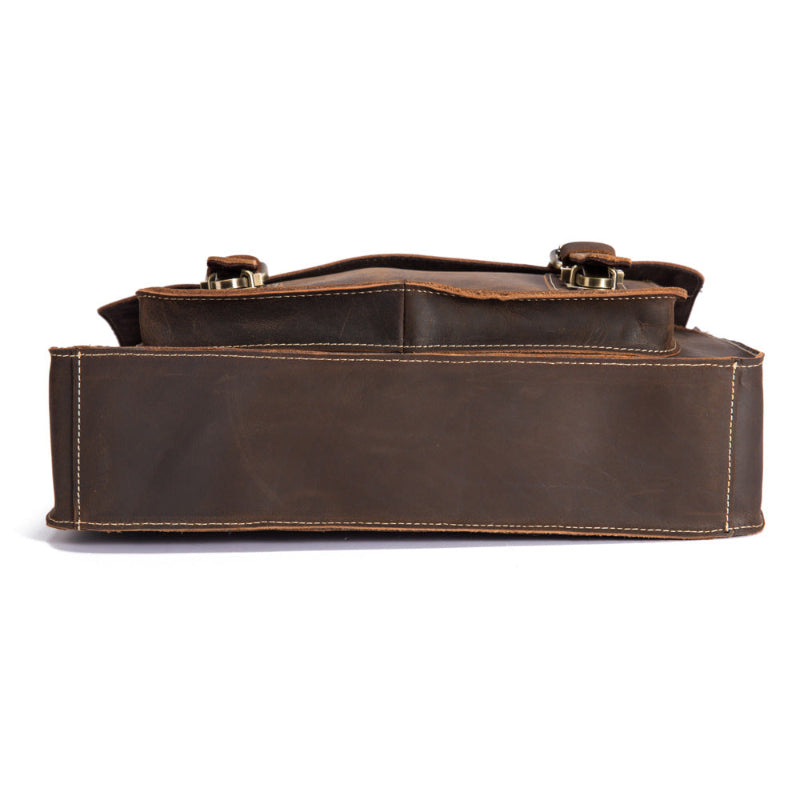 Coffee-brown leather handbag side view with top handle and stitched edges.