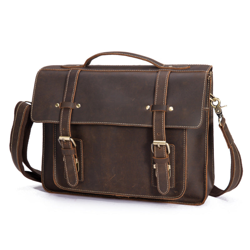Men's coffee leather messenger bag with top handle, front flap, and shoulder strap.