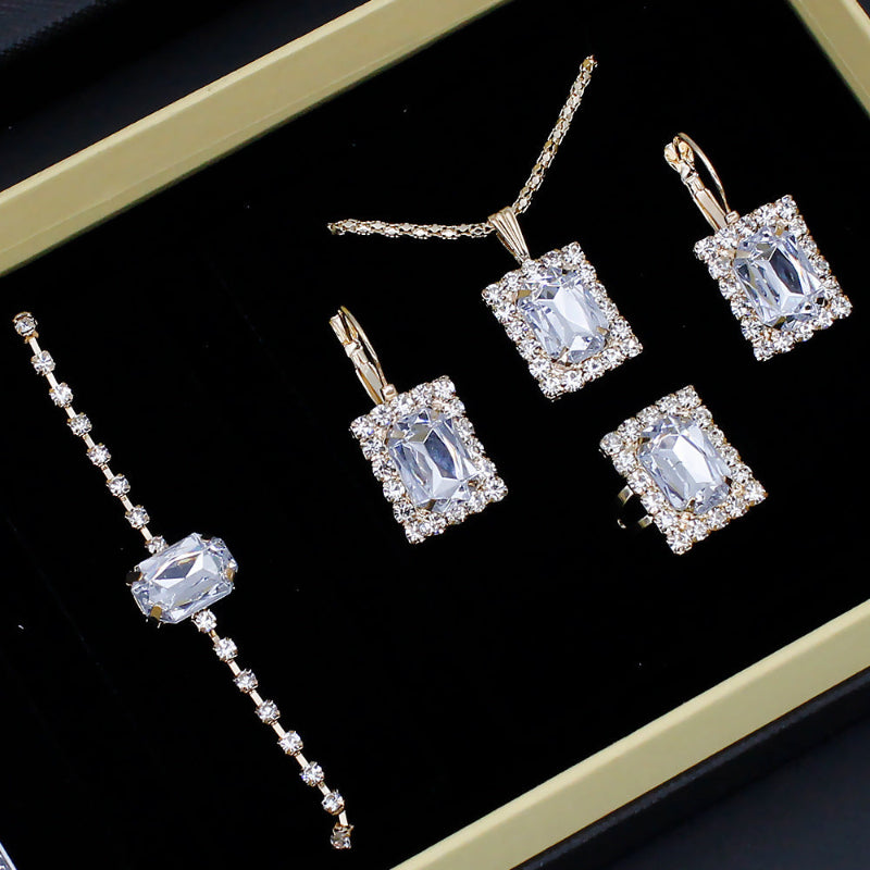 Rhinestone jewelry set in box: long tennis bracelet and four square drop earrings with blue stones