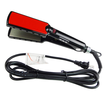 Red and black hair straightener with power cord on a white background