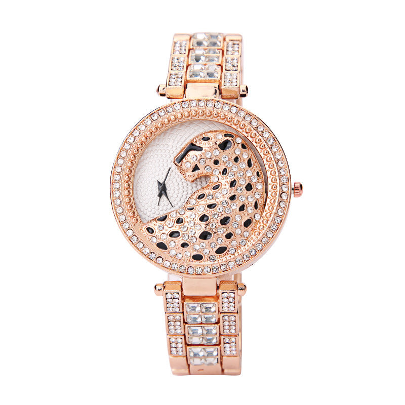 Rose gold watch with leopard design and diamond accents on a white background
