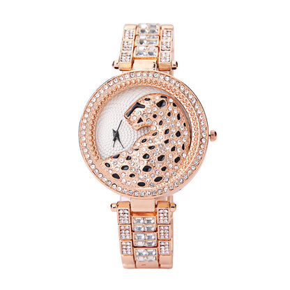 Rose gold watch with leopard design and diamond accents on a white background