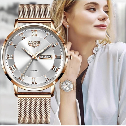 Rose gold watch with silver face worn by a woman, close-up view.