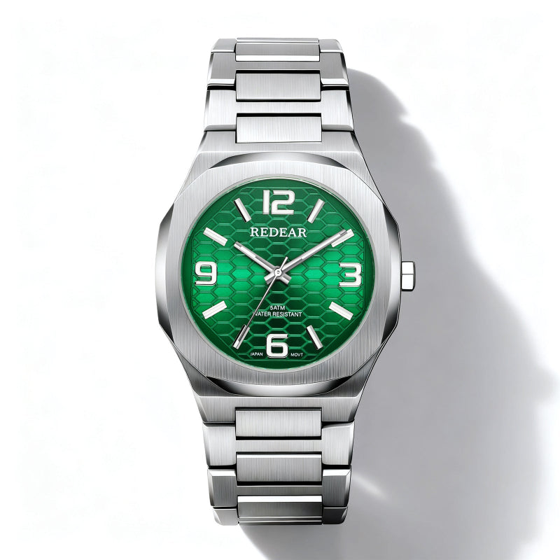 Silver watch with a green face on a white background