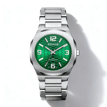 Silver watch with a green face on a white background