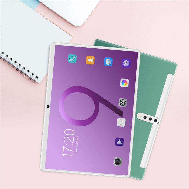 Tablet with a purple case on a pink surface
