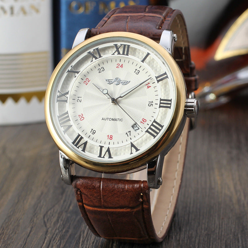 Gold-toned mechanical watch, silver dial with Roman numerals, brown leather strap.