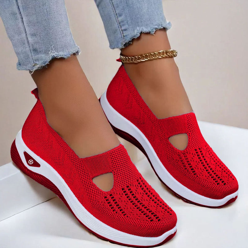 Women's Red slip-on shoes with cut-out design on a light background