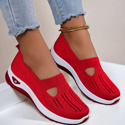 Women's Red slip-on shoes with cut-out design on a light background