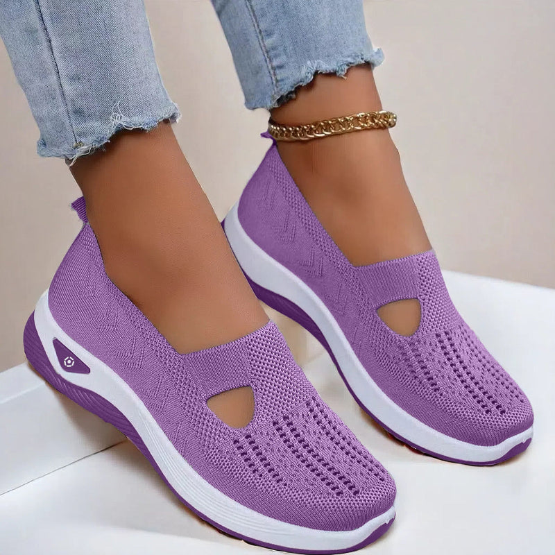 Women's Purple slip-on shoes with white soles on a light background