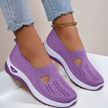 Women's Purple slip-on shoes with white soles on a light background