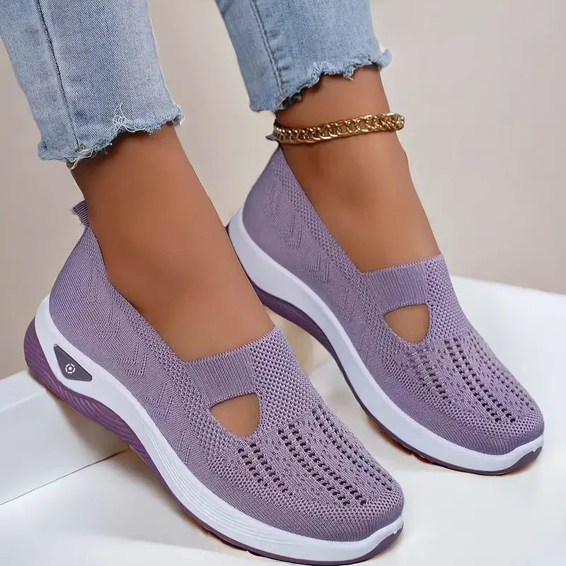Women's Purple slip-on shoes with white soles on a light background