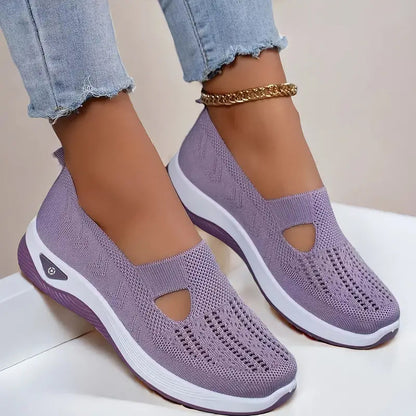 Women's Purple slip-on shoes with white soles on a light background