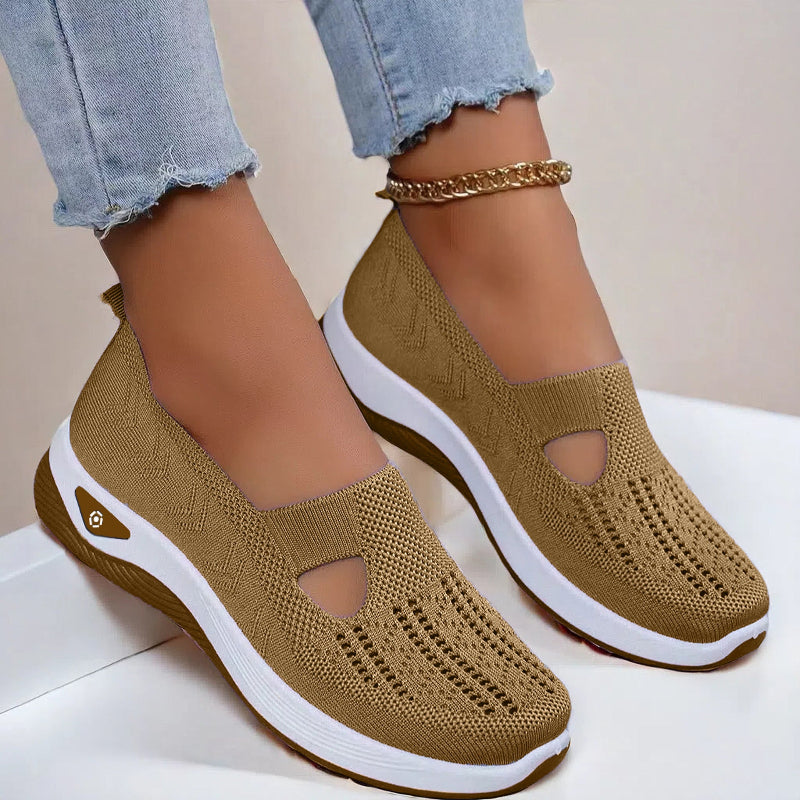Women's Brown slip-on shoes with white soles on a light background