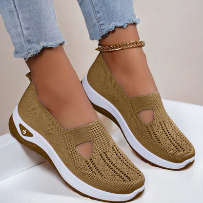 Women's Brown slip-on shoes with white soles on a light background