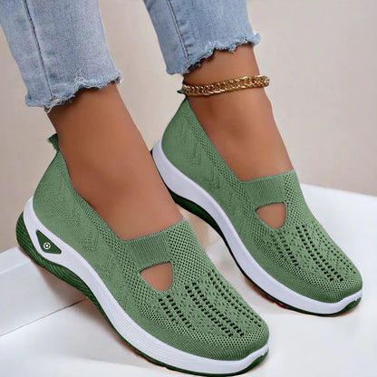 Women's Green slip-on shoes with white soles worn on a light background