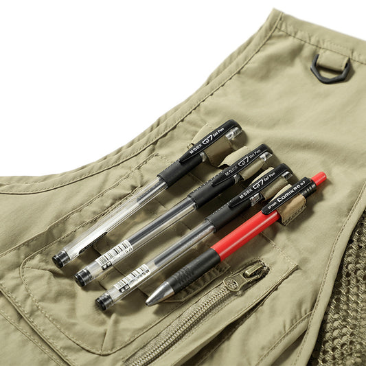 Set of pens in a vest pocket with a beige background