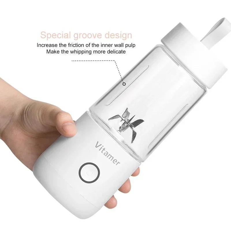 White portable blender bottle held in hand, clear cup and blade visible