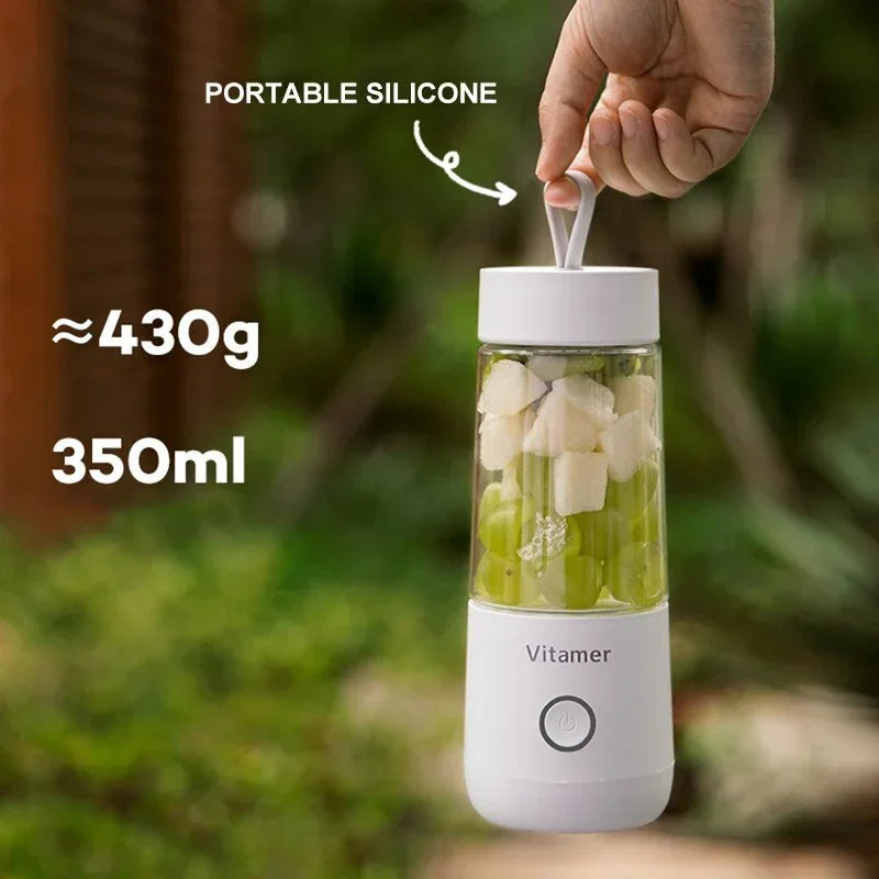 White 350 ml portable blender bottle with silicone straw lid holding fruit cubes
