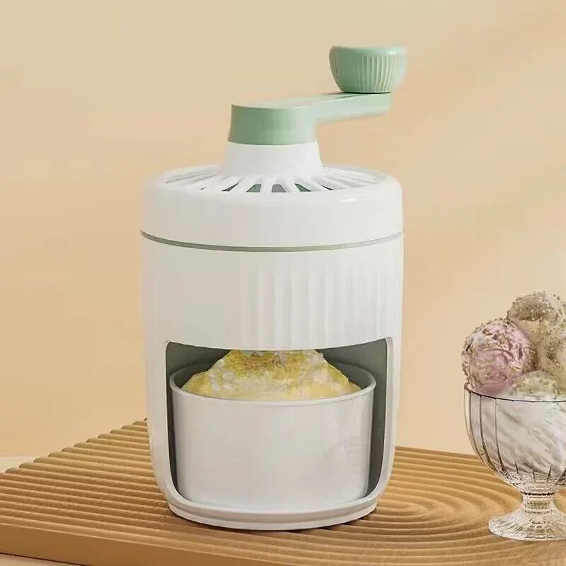 Hand-cranked ice crusher with mint green top and knob, white body, see-through ice bin